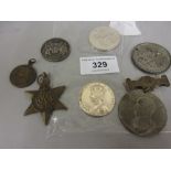 Small bag containing a quantity of various medallions including a World War II Italy star