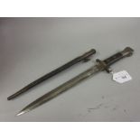 German bayonet with a scabbard, the 11.75in blade inscribed W.R. below a crown