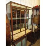 Early 20th Century mahogany and glazed shop display cabinet with open shelves All doors are