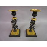Pair of early 19th Century gilt and dark patinated bronze candlesticks in the form of trees with