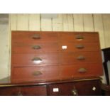 19th Century red painted pine bank of eight drawers having cast iron cup handles, 17ins high x 33ins