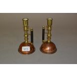Pair of Arts and Crafts copper, brass and wooden candlesticks with RD No. 53791 to the base, 6ins
