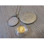 Small Cook Islands gold coin 1997, 1880 shilling mounted as a pendant and an Elizabeth II five pound