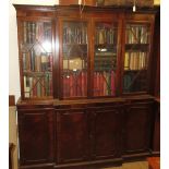 Reproduction mahogany breakfront bookcase, the moulded cornice above four astragal glazed doors with