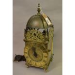 Antique hoop and spike lantern clock, the chapter ring with Roman numerals, signed F. Mile and