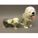 Beswick figure of a seated Old English sheep dog, 12ins high, together with a similar smaller Cooper