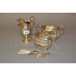 Silver pedestal cream jug, silver cream jug and matching sugar basin, together with three silver and