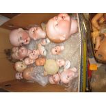 Quantity of various bisque dolls heads, including large Simon and Halbig head with sleeping and side