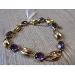 9ct Yellow gold amethyst and split seed pearl set alternating link bracelet Slight signs of wear but
