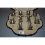Edwardian Art Nouveau silver ten piece condiment set together with six matching condiment spoons and