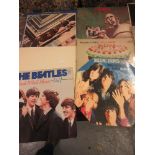 Quantity of long playing vinyl records including Rolling Stones, Beatles and Queen