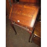 Small early 20th Century oak bureau with a fall front above a single drawer on cabriole supports