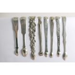 SHEFFIELD:- Eight various pairs of George III - George IV sugar tongs, mixed dates & makers, ranging