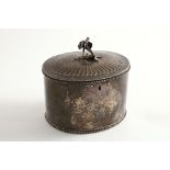 A GEORGE III OVAL TEA CADDY with bead borders & a low-domed fluted cover with a cast flower