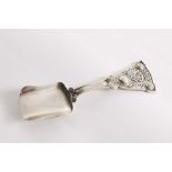 A SCOTTISH PROVINCIAL CADDY SPOON with a scoop bowl and a triangular terminal decorated with "
