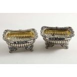 A PAIR OF EARLY VICTORIAN SALTS of rounded oblong form with part-fluted bodies, decorative borders