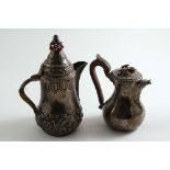 AN EARLY 19TH CENTURY SMALL FRENCH HOT MILK JUG with a flower finial and a small Middle Eastern