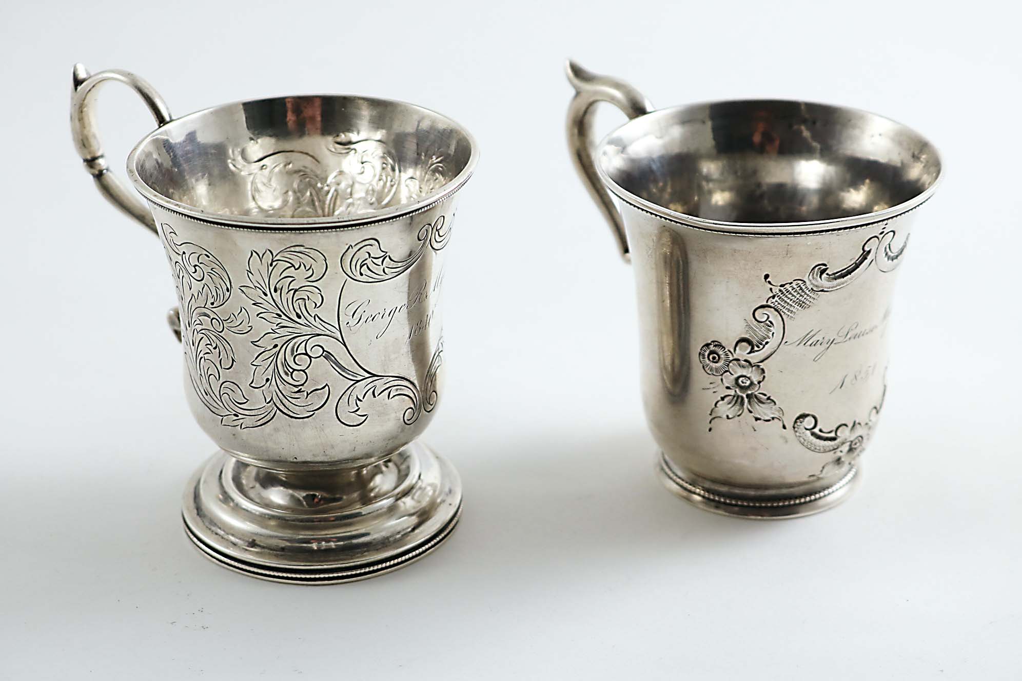 TWO MID-19TH CENTURY AMERICAN CHRISTENING MUGS with campana-shaped bowls: one with a circular