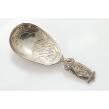 AN ARTS & CRAFTS CADDY SPOON with engraved geometric patterns in the bowl and on the stem, by