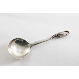 AN EARLY 20TH CENTURY DANISH BLOSSOM PATTERN CADDY OR JAM SPOON with a circular bowl, by Georg