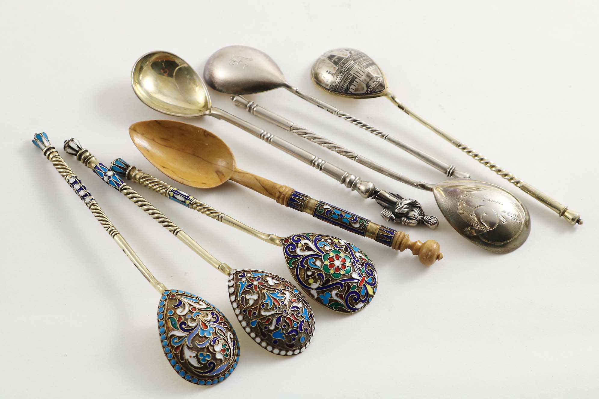THREE LATE 19TH / EARLY 20TH CENTURY RUSSIAN SILVERGILT AND CLOISONNE-ENAMELLED SPOONS, a Russian