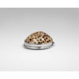 AN EARLY GEORGE II SILVER MOUNTED COWRIE SHELL SNUFF BOX with an engraved coat of arms* on the