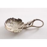 A VICTORIAN "STAMPED" CADDY SPOON with a vine leaf and grape-decorated bowl and a coiled tendril