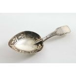 A SMALL PRIVATE COLLECTION OF ANTIQUE CADDY SPOONS A George III engraved caddy spoon with a heart-