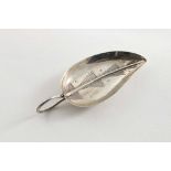 A GEORGE III "LEAF" CADDY SPOON with engraving and a tendril handle, initialled "CE" on the back