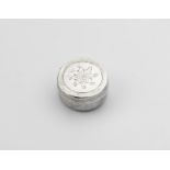 A WILLIAM & MARY SILVER PATCH BOX circular with matted sides, the pull-off cover engraved with a