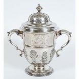 AN EARLY GEORGE II CUP & COVER with twin. leaf-capped scroll handles and a campana-shaped body