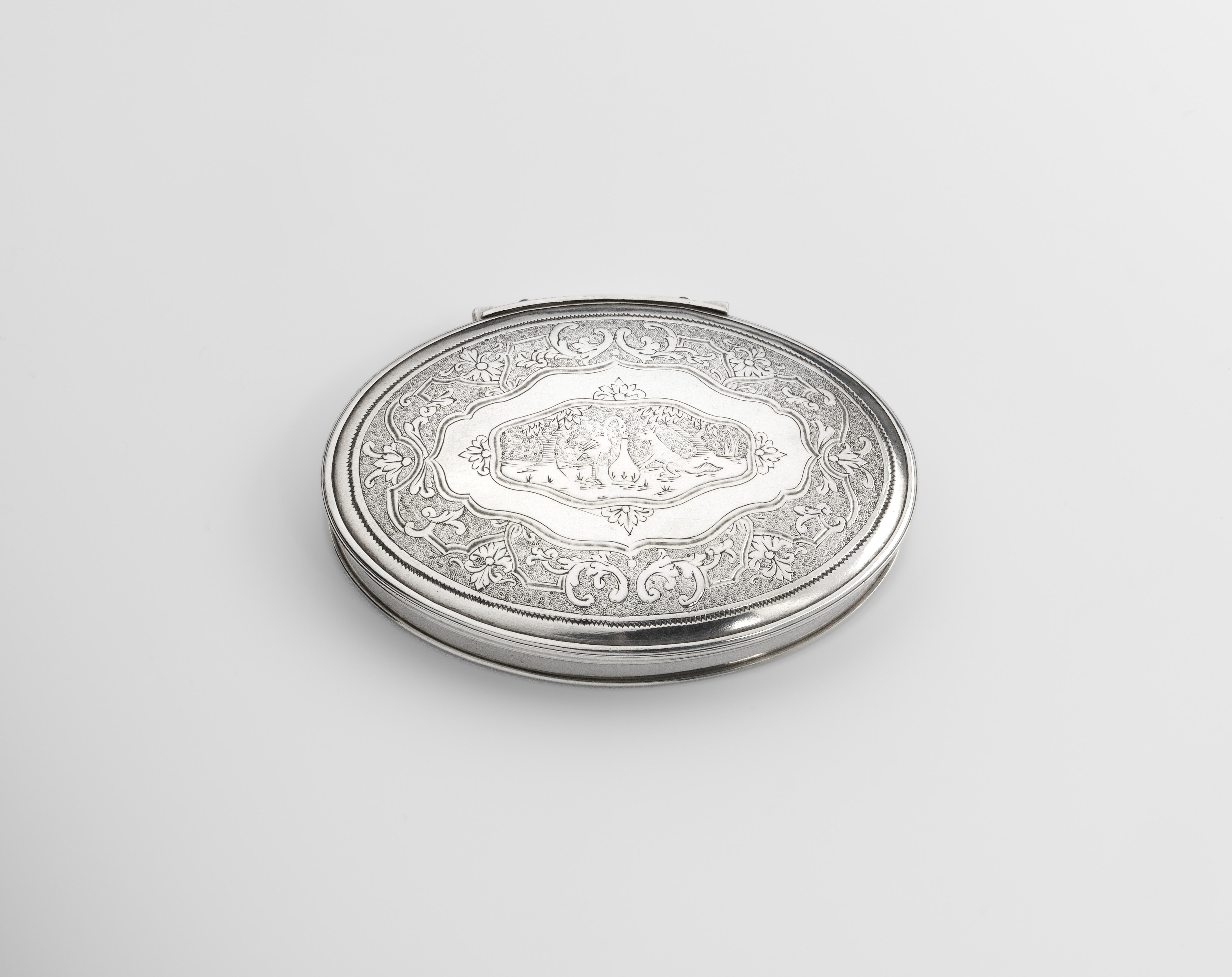 A GEORGE I SILVER SNUFF BOX oval with a "stand-away" hinge, reed borders and a slightly dome