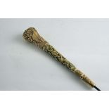 A CHINESE PARASOL HANDLE ivory carved with terrapins and signed floral gold plated mounts, 23 cms