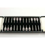 A LATE 20TH CENTURY CASED SET OF TWELVE COCKTAIL STICKS with enamelled playing card terminals (Jack,
