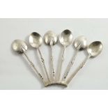 A SET OF EARLY 20TH CENTURY SEAL TOP COFFEE SPOONS with part-wrythen stems, a hammered finish and