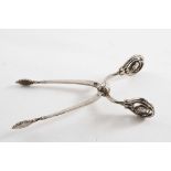 AN EARLY 20TH CENTURY DANISH PAIR OF BLOSSOM PATTERN SUGAR NIPS with a sprung pivot, by Georg