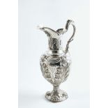 A WILLIAM IV LARGE WINE EWER of classical vase form with a helmet shaped rim, and a vine tendril