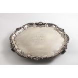 A LATE VICTORIAN SALVER of shaped circular outline with a bead, shell & scroll border and an