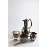 A MIDDLE / FAR EASTERN THREE-PIECE COFFEE SET decorated with borders of chasing and part-fluting and