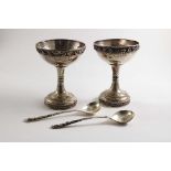 A PAIR OF EARLY 20TH CENTURY PEDESTAL SUNDAE CUPS with corded & braided borders and an applied