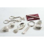 A MIXED LOT:- Three modern pill boxes, two key rings with pendant flat fish, a sovereign case, a
