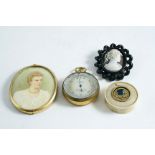 A POCKET BAROMETER with silvered dial in gilt brass case, Callaghan & Co., 5 cms; a Victorian