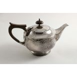 A SMALL PRIVATE COLLECTION OF ARTS & CRAFTS SILVER AN EARLY 20TH CENTURY CIRCULAR TEA POT with a