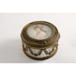 A LATE 19TH / EARLY 20TH CENTURY GILT-METAL MOUNTED GLASS DRESSING TABLE BOX circular with floral