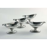 A SET OF FOUR VICTORIAN BOAT-SHAPED SALTS on oval pedestal bases with bead borders and scroll
