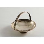 AN EARLY 20TH CENTURY SHALLOW CIRCULAR BONBON DISH with a hammered finish, a circular foot and a