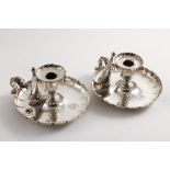 A PAIR OF OLD SHEFFIELD PLATED CIRCULAR CHAMBERSTICKS with shaped & fluted rims, detachable