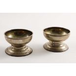 A PAIR OF EARLY GEORGE II SPOOL-SHAPED SALTS with gilt interiors, by James Smith, London 1730/31; 3"