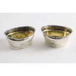 A PAIR OF GEORGE III OVAL SALTS with reeded rims & gilt interiors, initialled, by John Langlands (