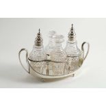 A GEORGE III BOAT-SHAPED CRUET STAND with bead borders & twin loop handles, crested, by J. Wakelin &